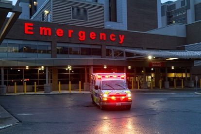 Ambulance parked outside MLPS base with lights on